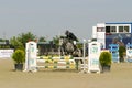 Equitation contest, horse jumping over obstacle