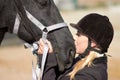 Horse kiss, trainer and woman on equestrian training and competition ground with a pet. Outdoor, female and show horses Royalty Free Stock Photo