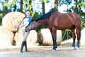 Horse kisses her owner- young lady`s hand.