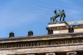 Horse with man bronze sculpture on the roof of Old Museum - Altes Museum in Berlin, Germany Royalty Free Stock Photo