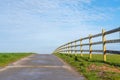 Horse meadow with a road next to it Royalty Free Stock Photo