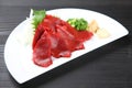 Horse meat sashimi with green onion Royalty Free Stock Photo
