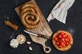 Horse meat sausage rolled on wooden cutting board Royalty Free Stock Photo