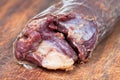 Horse meat sausage kazy close up on chopping board Royalty Free Stock Photo