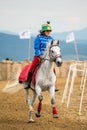 Horse parade during a horse show with young girl riding