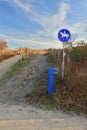 Horse path sign next to the barrier