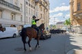 Horse police with Swedish army band on street in Stockholm