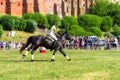 A horse ridden by a female jockey participates in a riding championship, Grudziadz, Poland - June 18, 2023