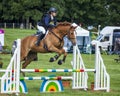 Horse rider competing in Cross Country Event.