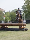 Horse rider jumping over a barrier Royalty Free Stock Photo