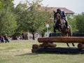 Horse rider jumping over a barrier Royalty Free Stock Photo