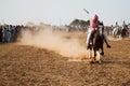 Horse rider, riding in a tent pegging event