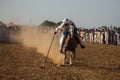 Horse rider, riding in a tent pegging event