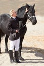 Horse rider, trainer and woman on equestrian training and competition ground with a pet. Outdoor, female competitor and