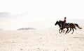 Horse Riders Around the Pyramids Royalty Free Stock Photo