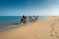 Horse riders on the beach Royalty Free Stock Photo