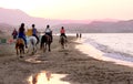 Horse riders on the beach