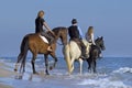 Horse riders in the sea Royalty Free Stock Photo
