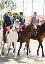 Horse riders taking a walk by the fair of Seville Royalty Free Stock Photo