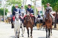 Horse riders taking a walk by the fair of Seville Royalty Free Stock Photo