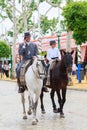 Horse riders taking a walk by the fair of Seville Royalty Free Stock Photo