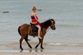 Horse riding on the beach Royalty Free Stock Photo
