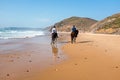 Horse riding at the beach at the ocean Royalty Free Stock Photo