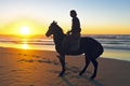 Horse riding on the beach Royalty Free Stock Photo