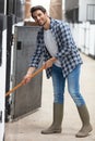 horse riding center groom cleaning stales