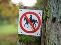 Horse riding prohibited or forbidden sign in black, white, red in forest near Berlin, Germany