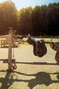 Horse saddle riding equipment on fence Royalty Free Stock Photo