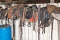 Horse saddles in barn Royalty Free Stock Photo