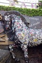 Horse sculpture with advertising stickers