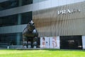 Horse sculpture sculpture stands near luxury Prada store