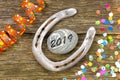 Horse shoe as talisman for new year`s date 2019 Royalty Free Stock Photo