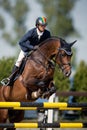 Equestrian Horse Rider Jumping.Picture showing a competitor performing in show jumping competition Royalty Free Stock Photo