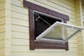 Horse in a stable window in the village Vladykino in Russia