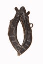 Horse tack on a wooden wall.