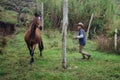 Horse trainer training a mare