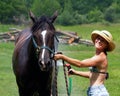 Horse Wash Hat Girl in shorts 2 Royalty Free Stock Photo