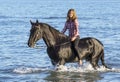 Horse woman in the sea Royalty Free Stock Photo