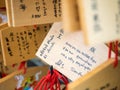 Horse wooden prayer tablets with thai hand writing at Kiyomizu d