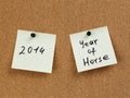 Horse year reminder note on cork board