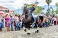 Horseback cowboy rides in village, Guatemala Royalty Free Stock Photo
