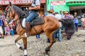 Horseback cowboys ride in village, Guatemala