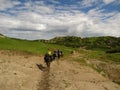 Horseback riding in the high mountain countryside Royalty Free Stock Photo