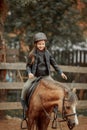 Horseback riding little girl on pony Royalty Free Stock Photo