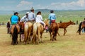 Horseback spectators on steppe, Nadaam horse race, Mongolia