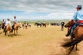 Horseback spectators on steppe, Nadaam horse race