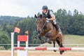 Horseman in protective vest during the jump